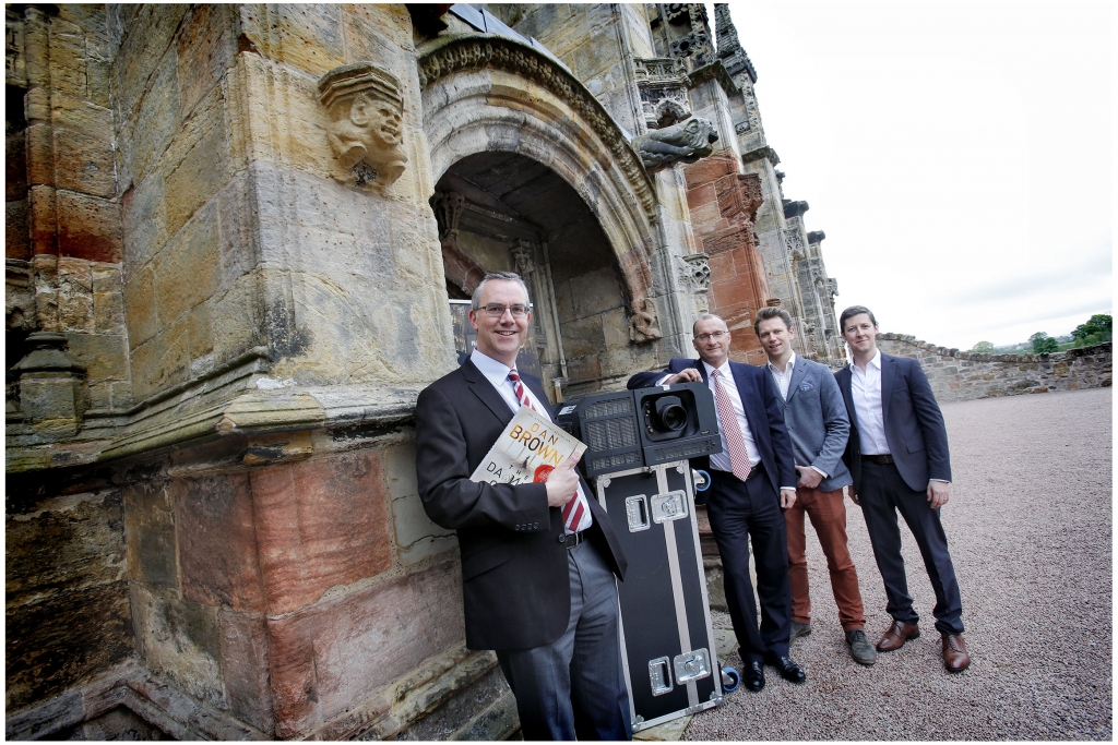 READY FOR ACTION.......TO MARK THE 10TH ANNIVERSARY OF THE DA VINCI CODE MOVIE, SPECIAL OUTDOOR SCREENINGS OF THE TOM HANKS FILM, RELEASED ON 19 MAY 2006, WILL BE SHOWN AT ROSSLYN CHAPEL, ONE OF THE FILMS KEY LOCATIONS.
PICTURED AT ROSSLYN CHAPEL WITH A MOBILE PROJECTOR ARE IAN GARDNER (LEFT TO RIGHT), DIRECTOR OF ROSSLYN CHAPEL TRUST, MARK HALLAM OF SPONSORS QUILTER CHEVIOT, PETE JOHNSON AND IAN BROWN OF FILM MOBILE.